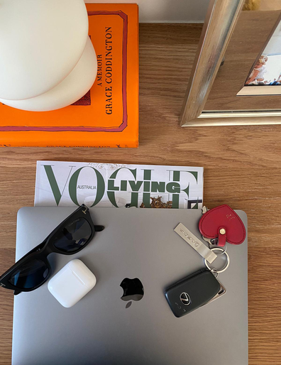 Packing for weekend away: Macbook, magazine, car keys, sun glasses