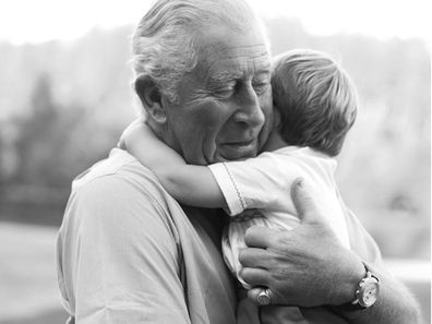 Prince Charles hugging Prince Louis