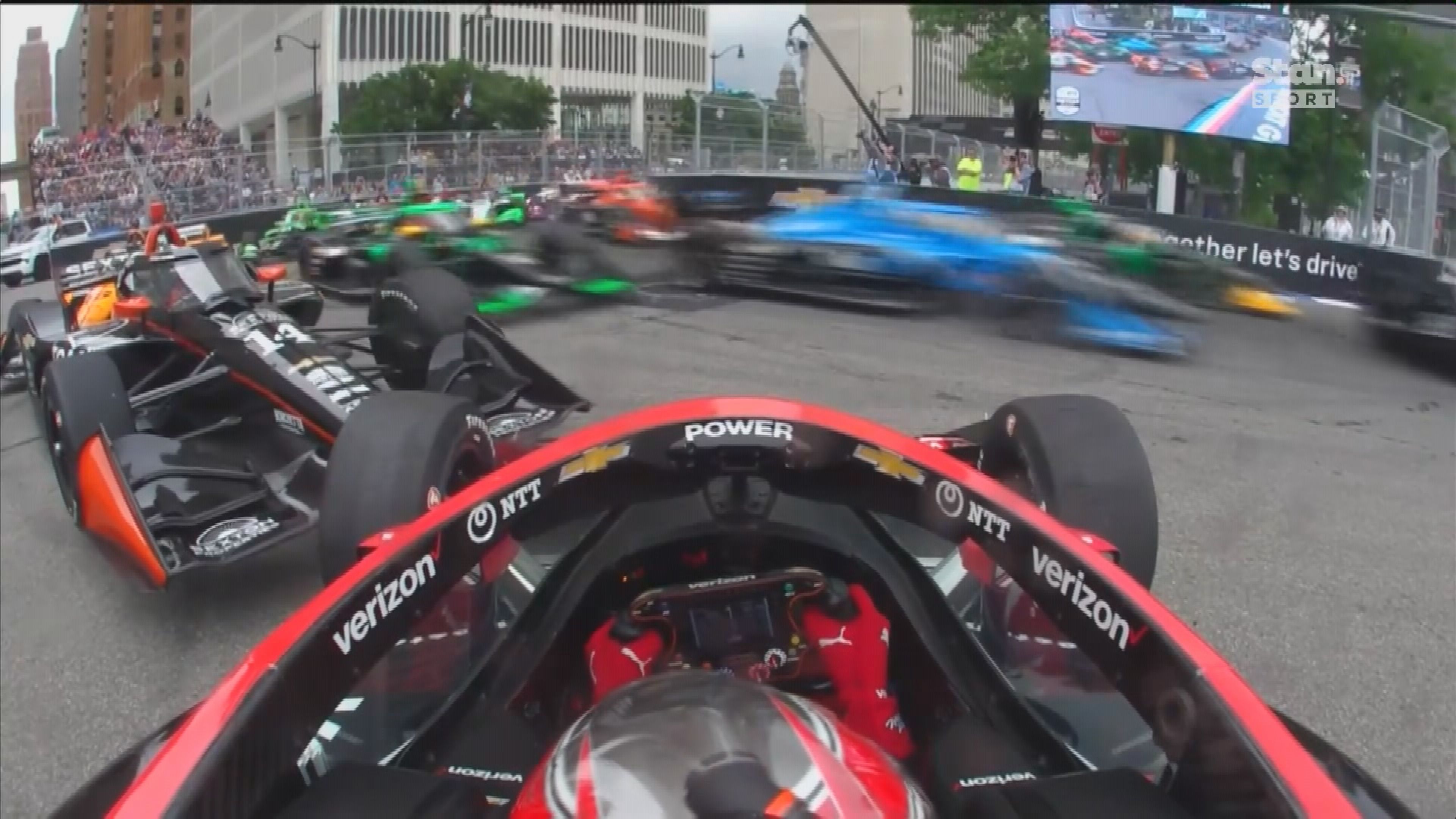 Will Power was left stranded blocking the track after being spun on the opening lap of the Detroit IndyCar Grand Prix.