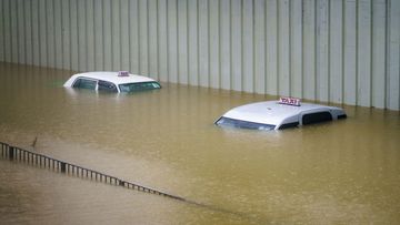 Taxis submerged in floodwater during heavy rain in Hong Kong, China, on Sept. 8, 2023. Hong Kongs heaviest rainstorm since records began in 1884 flooded the financial hubs streets and sent torrents of water rushing through subway stations, bringing much of the city to a standstill and forcing the stock market to halt morning trading on Friday. Photographer: Justin Chin/Bloomberg