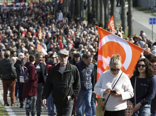Protesters march during a rally in Bayonne, southwestern France, Thursday, April 6, 2023.