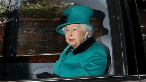 Queen Elizabeth II is driven away after attending a Sunday service at St Mary Magdalene church on the Royal Sandringham estate in Norfolk. (AAP)