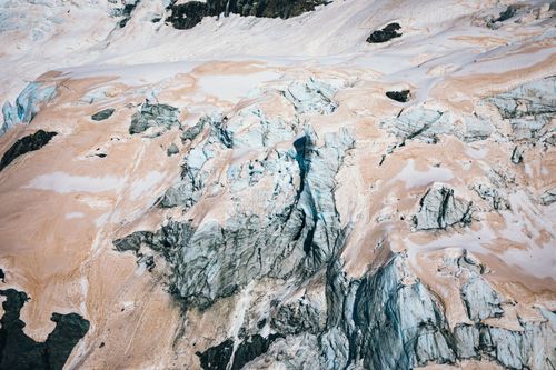 Travel photographer and blogger Liz Carlson took the pictures of the pink and red glaciers during a helicopter flight.