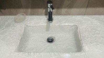 Shattered bathroom vanity sink 