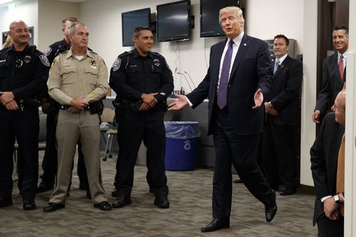 President Donald Trump arrives to meet with first responders at the Las Vegas Metropolitan Police Department. (AAP)