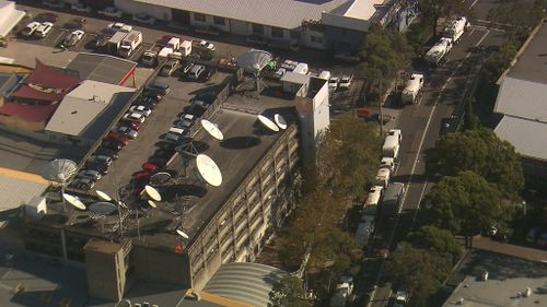 The trucks gather outside SBS. (9NEWS)