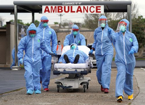 A person is taken on a stretcher into the United Memorial Medical Centre after going through testing for COVID-19 Thursday, March 19, 2020, in Houston. Picture: David J. Phillip