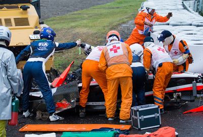 The Marussia driver collided with a tractor in a wet Japan Grand Prix. (AAP)