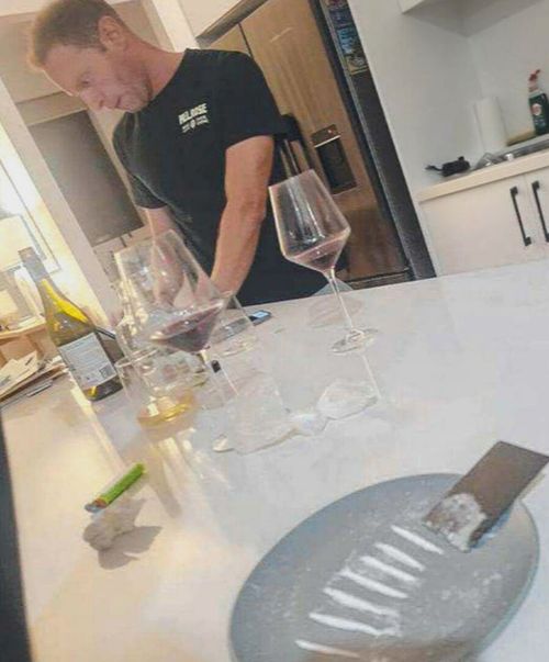 A photo published by News Corp also appeared to show David Speirs near a plate with seven lines of white powder on it.