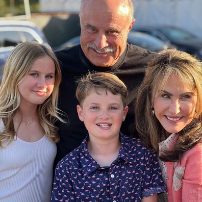 Dr. Phil McGraw and his wife Robin pose with their two eldest grandchildren over Easter.