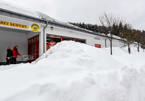 Snow next to a supermarket near Breitenbrunn at Ore mountains, Germany.