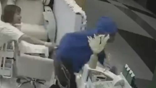 Police are searching for a woman who entered a Queensland nail salon and snatched a customer's bag.