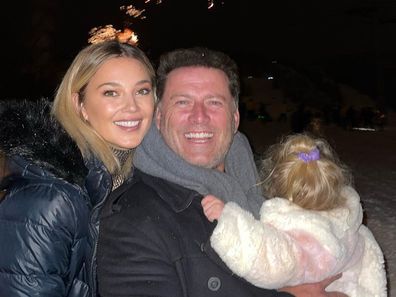 Jasmine Stefanovic and Karl Stefanovic and their daughter Harper celebrate New Year's Eve in front of fireworks
