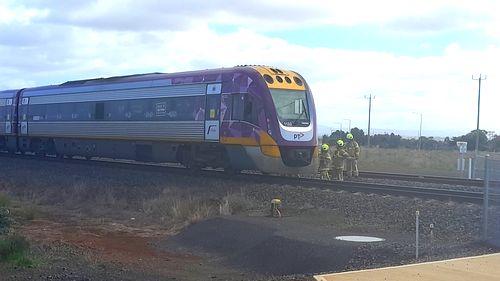 Woman hospitalised after car hit by train in Melbourne's west