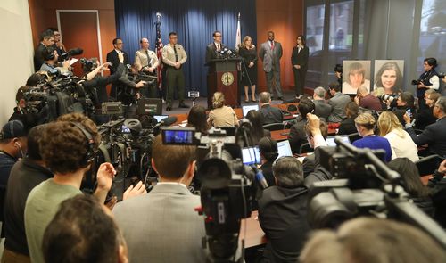 A massive media scrum has taken over the Riverside County Court press room. (AAP)