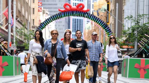 Shoppers are seen during the Christmas trade period on George Street in Sydney's CBD.