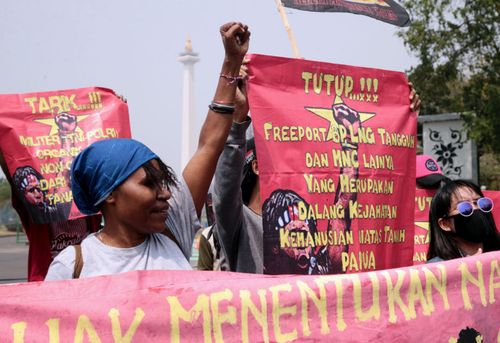 West Papuan activist hold a banner reading 'Right of self-determination for Papuan people' during a rally near the State Palace in Jakarta, Indonesia, last month.