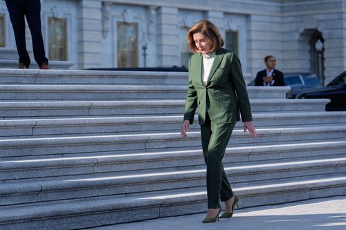 Speaker Emerita Nancy Pelosi, D-Calif., who has announced she will not seek reelection to the U.S. House, walks to join fellow Democrats at an event on the health care fight on the steps of the House before votes to end the government shutdown, at the Capitol in Washington, Wednesday, Nov. 12, 2025. (AP Photo/J. Scott Applewhite)