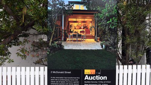 A for sale sign is displayed in front of a house in Sydney earlier this year. (Image: AAP)