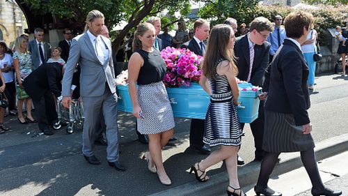 Mourners carry the casket of equestrian rider Olivia Inglis during her funeral service at St Jude's Church Randwick. (AAP)