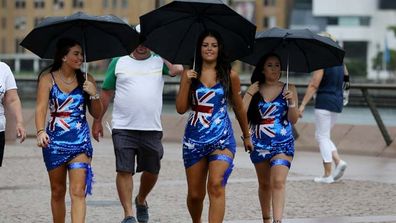 <b>HOW THE COUNTRY CELEBRATED</b>: Beach, barbies and sport were the order of the day, whether in rainy Sydney or sunny Melbourne. 