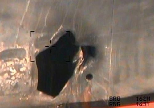 This image released by the US Department of Defence, taken from a US Navy helicopter, shows what the Navy says is blast damage to the motor vessel M/T Kokuka Courageous, consistent with a limpet mine attack.