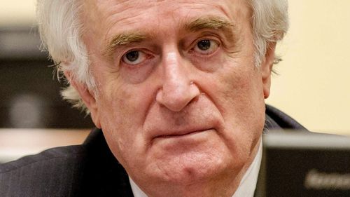 Radovan Karadzic listen to the verdict in a courtroom in The Hague. (AAP)