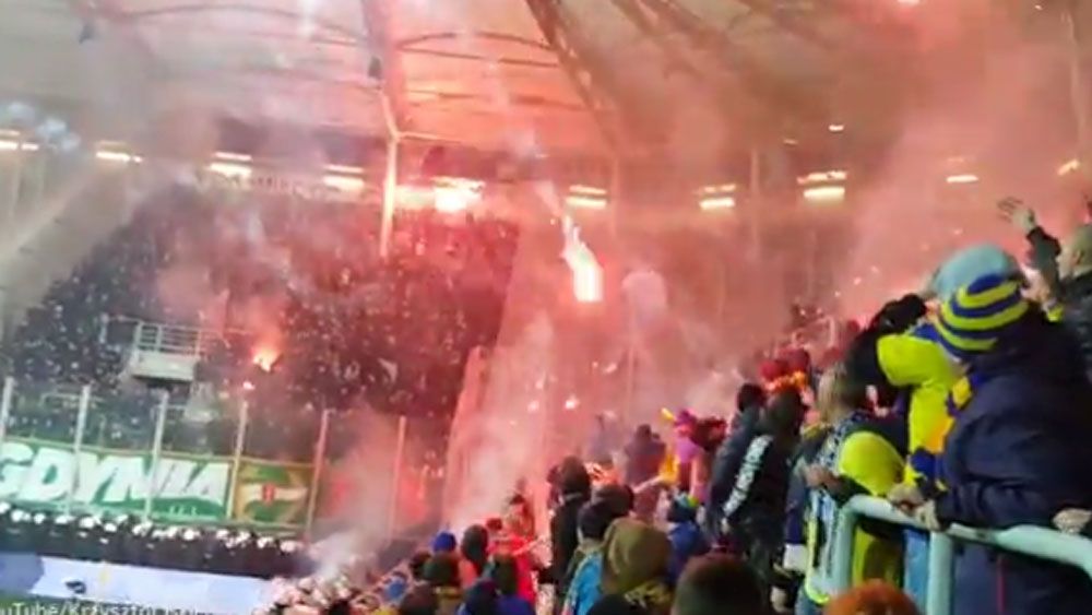 Polish football fans use flares as weapons