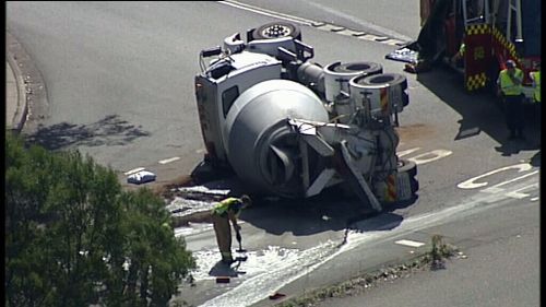Cement truck rollover causes road closures in North Ryde 