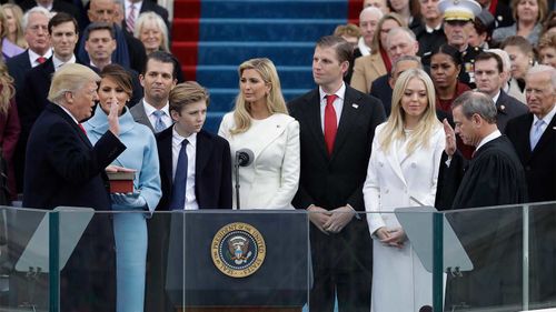 Donald Trump taking the oath of office surrounded by his family in 2017.
