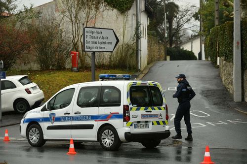 Municipal police secure a perimeter around Saint-Thomas dAquin middle school where a teacher died after being stabbed by a student, in Saint-Jean-de-Luz, southwestern France, on February 22, 2023.