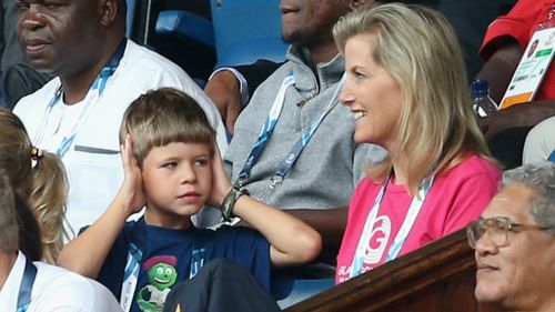 Sophie, Countess of Wessex and her son James, Viscount Severn, who may be finding the noise a bit much as Scotland play New Zealand in the Rugby Sevens.