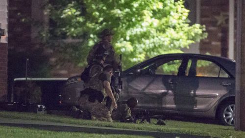 Specialist police at the scene of the operation in which Driver was killed. (AAP)