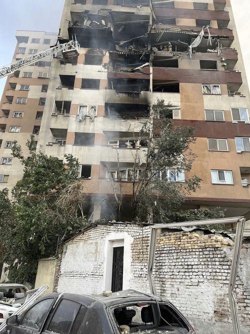 Firemen activity astatine an flat building aft it was deed successful Tehran.