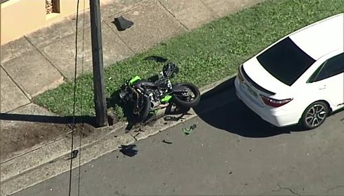 A 30-year-old man died after crashing his motorcycle in a suburban street in Auburn and being thrown several metres. Picture: 9NEWS.