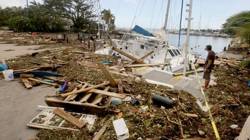 Debris sits from a sailboat that crashed and smashed at the Dinner Key Marina in Miami, on September 11. (AAP)