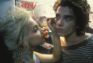 When was Michael Hutchence's feature film debut, Dogs in Space, first released in cinemas?