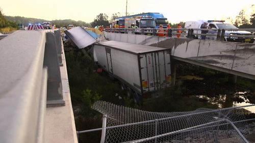 The truck had veered into a creek dividing the north and southbound lanes of the Pacific Highway at Raleigh.