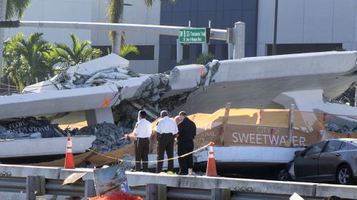 The pedestrian bridge is believed to have fallen during "stress tests" that involved the tightening of cables (AAP).