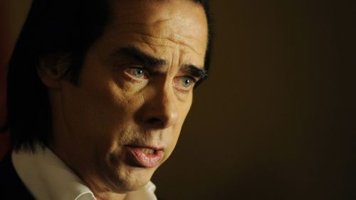 Nick Cave joins hundreds of writers in appeal to sack arts minister George Brandis