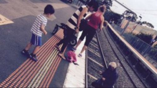 Commuters rescue toddler from train tracks in Melbourne