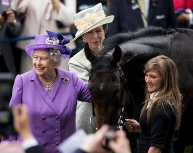 Queen Elizabeth pats her Gold Cup winning horse Estimate on Ladies Day of Royal Ascot in 2013. 