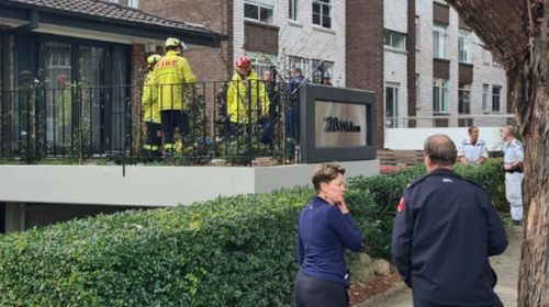 A lift technician has been rescued after getting his head stuck between a lift and the shaft in Sydney.