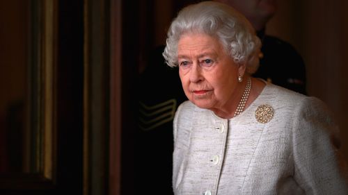 Queen Elizabeth II poses on the balcony at Buckingham Palace on November 4, 2015.