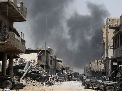 Smoke currently hangs over the Old City as it is continually
rocked by air strikes and artillery salvos aimed at
the remaining insurgents. (AFP)