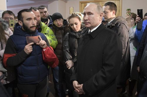 Vladimir Putin visiting victims of the horror supermarket blaze which killed at least 64 people in the Siberian city of Kemerovo. Picture: AAP