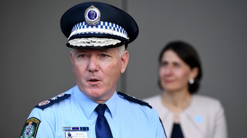 NSW Police Commissioner Mick Fuller speaks to the media during a press conference in Sydney. Premier Gladys Berejiklian stands in the background.