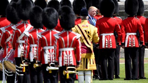 Donald Trump inspects the Queen's guard.