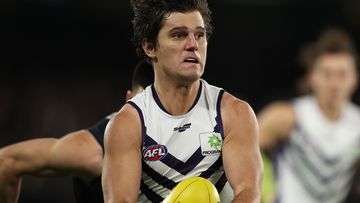 MELBOURNE, AUSTRALIA - JUNE 25: Lachie Schultz of the Dockers runs with the ball during the round 15 AFL match between the Carlton Blues and the Fremantle Dockers at Marvel Stadium on June 25, 2022 in Melbourne, Australia. (Photo by Robert Cianflone/Getty Images)