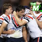 Roosters players celebrate with hooker Brandon Smith during their round six clash with the Knights.